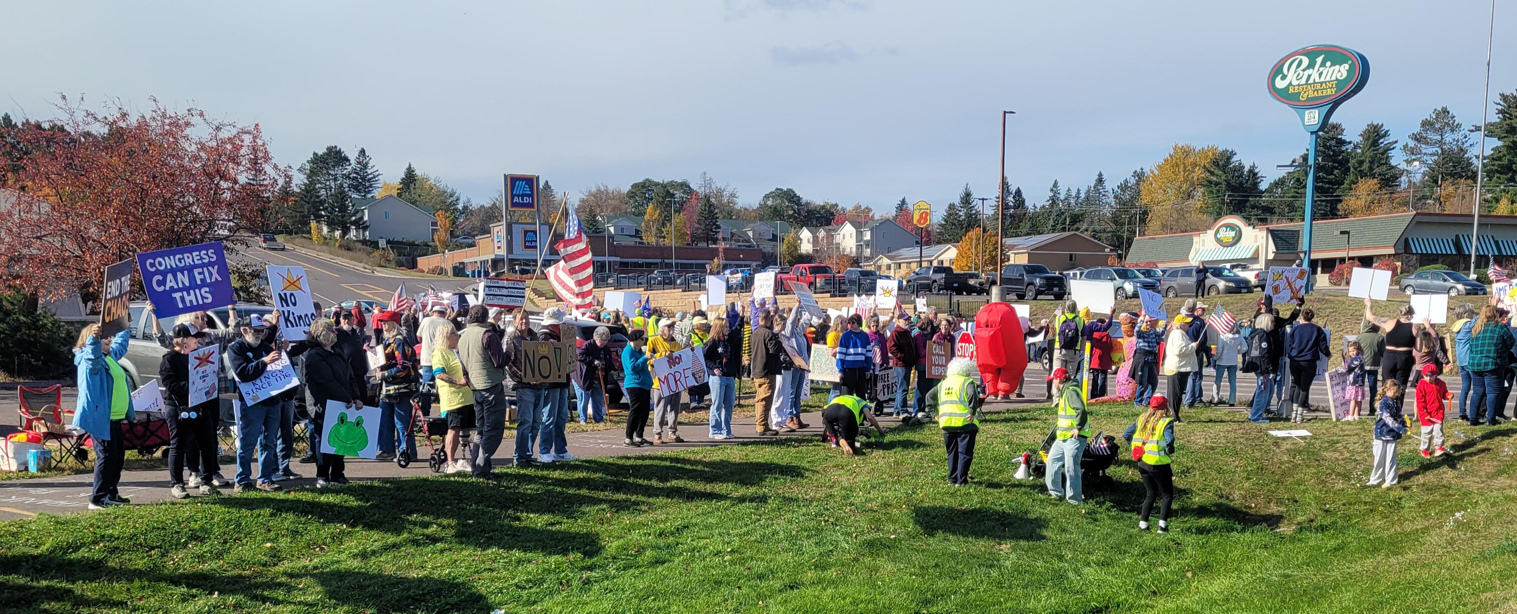 Members of We The People Cloquet Area Indivisible participating No Kings 2.0 event in Cloquet, Minnesota